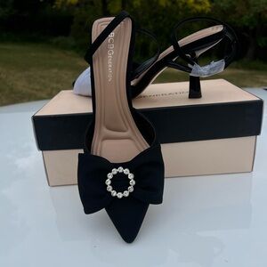 BCBGeneration Black Pointed-Toe Slingback Heels with Bow and Rhinestone Ring